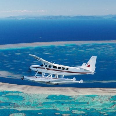 How do I get to Airlie Beach from Hamilton Island Airport?