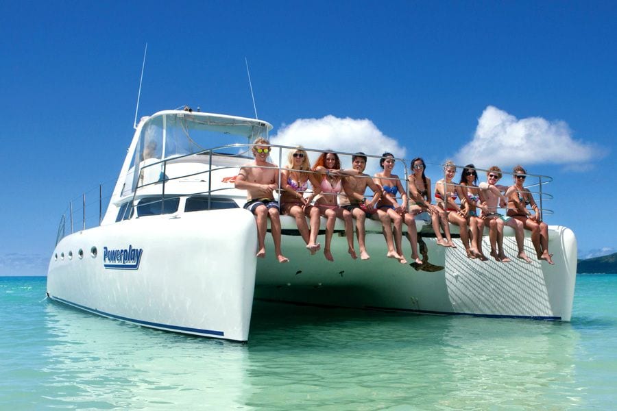 a group of people hanging out on a boat.